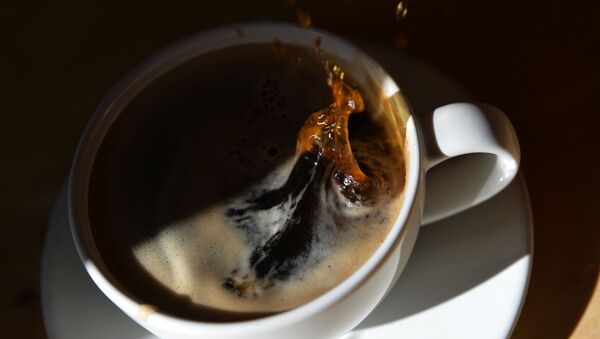 Una taza de café - Sputnik Mundo