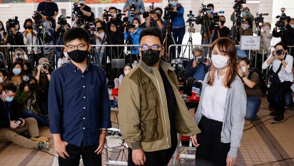 Los activistas hongkoneses Ivan Lam, Joshua Wong, Agnes Chow - Sputnik Mundo