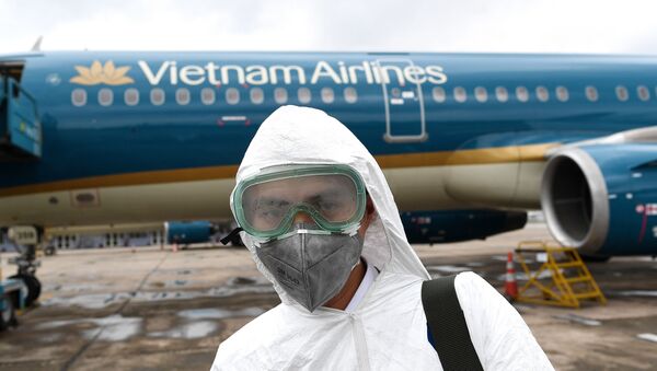 Imagen referencial de un pasajero cogiendo un avión en Vietnam - Sputnik Mundo