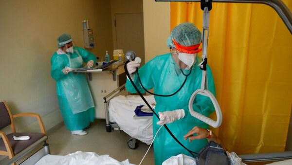 Médicos alemanes durante el brote de coronavirus - Sputnik Mundo