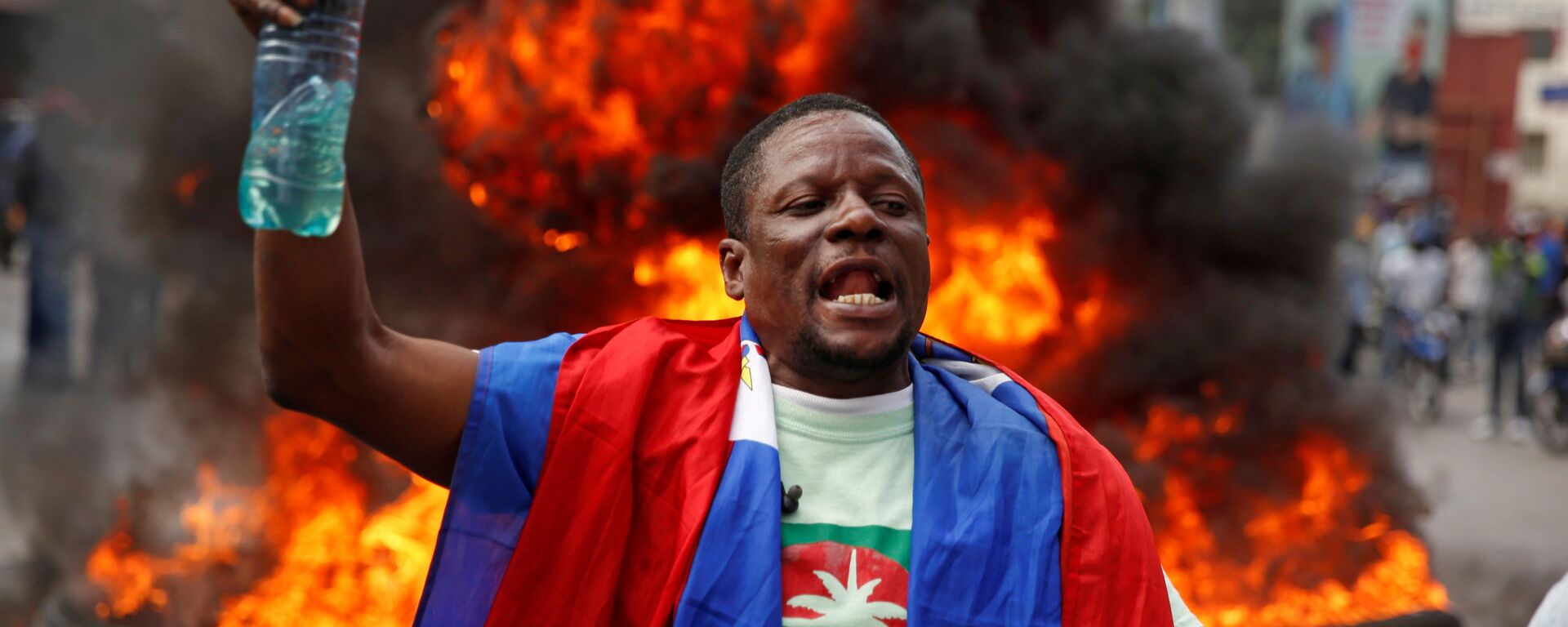 Un participante de protestas en Haití - Sputnik Mundo, 1920, 10.02.2021