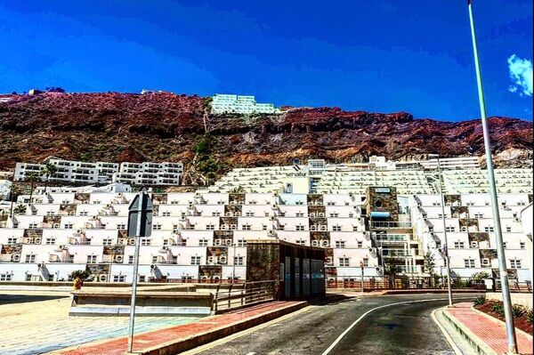 Hoteles de Puerto Rico, al sur de Gran Canarias, una de las zonas turísticas por excelencia y con más hoteles de acogida de inmigrantes - Sputnik Mundo