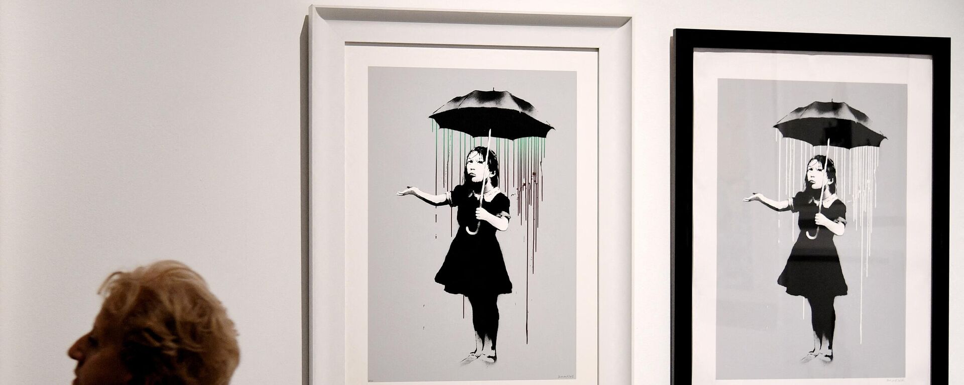 La obra de Banksy 'Chica con paraguas'  - Sputnik Mundo, 1920, 23.06.2021