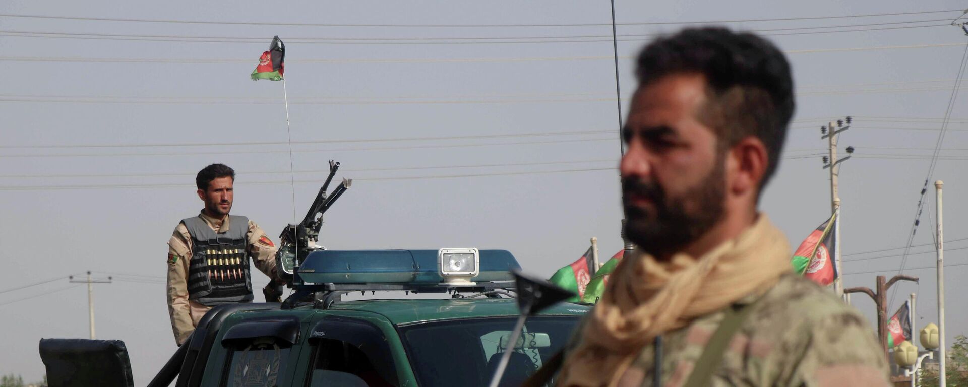 Las fuerzas de seguridad afganas vigilan un puesto de control en el distrito de Guzara de la provincia de Herat, Afganistán, el 9 de julio de 2021 - Sputnik Mundo, 1920, 16.07.2021