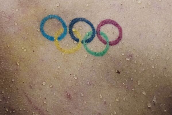 Tatuaje en la espalda del nadador estadounidense Townley Haas. - Sputnik Mundo