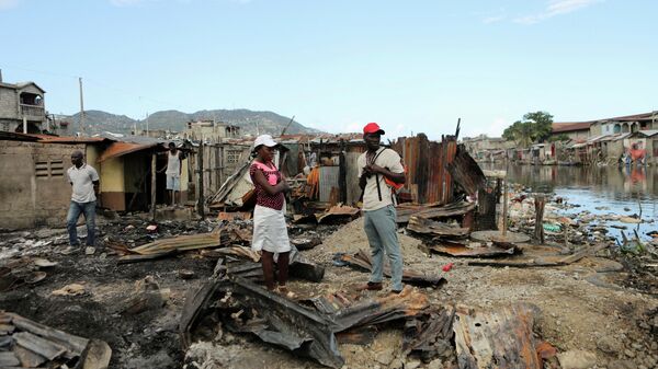 Las consecuencias de la explosión de un camión cisterna el 14 de diciembre que transportaba combustible en el norte de Haití - Sputnik Mundo