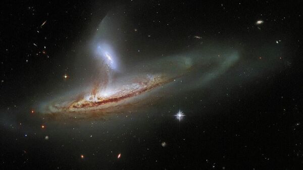Una impresionante interacción entre dos galaxias captada por el telescopio Hubble - Sputnik Mundo
