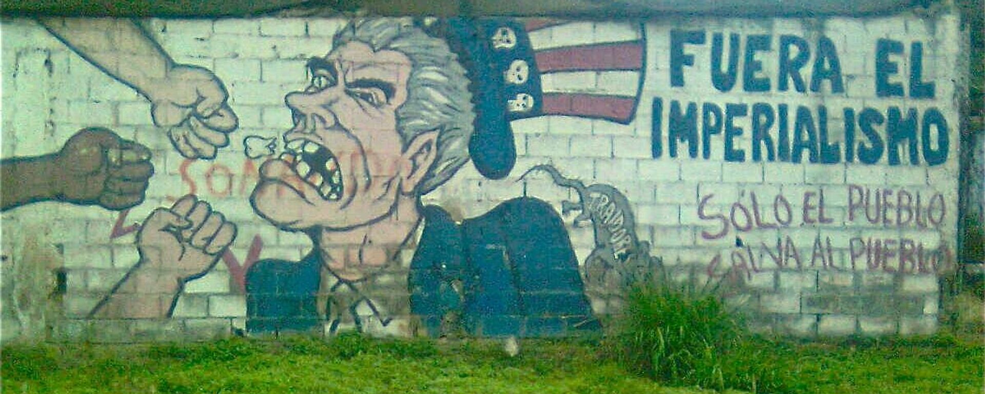 Grafiti en contra del imperialismo estadounidense en una pared en Caracas, Venezuela. - Sputnik Mundo, 1920, 14.02.2024