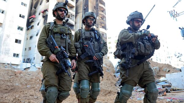 Soldados israelíes en la Franja de Gaza en febrero de 2024 - Sputnik Mundo