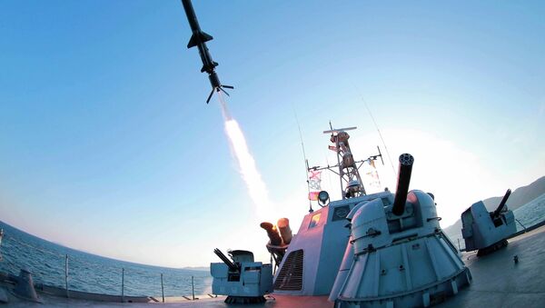 A missile is fired from a naval vessel during the test-firing of a new type of anti-ship cruise missile to be equipped at Korean People's Army (KPA) naval units in this undated photo released by North Korea's Korean Central News Agency (KCNA) in Pyongyang February 7, 2015. - Sputnik Mundo