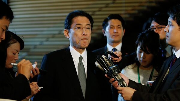 Japan's Foreign Minister Fumio Kishida listens to questions from reporters - Sputnik Mundo