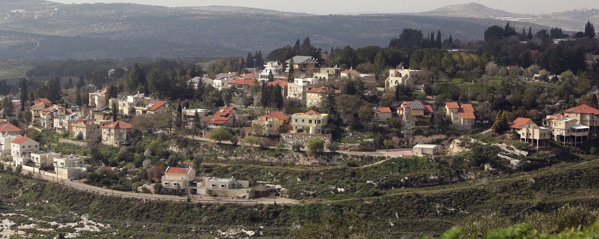 A picture shows a partial view of the Israeli settlement of Qadumim (Kedumim), near the Palestinian town of Nablus, in the Israeli-occupied West Bank, on February 9, 2015 - Sputnik Mundo, 1920, 11.04.2019