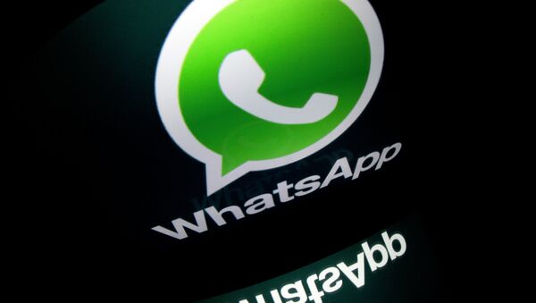 The logo of mobile app WhatsApp is displayed on a tablet on January 2, 2014 in Paris - Sputnik Mundo