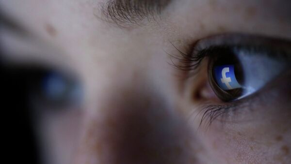 A picture illustration shows a Facebook logo reflected in a person's eye, in Zenica, March 13, 2015 - Sputnik Mundo