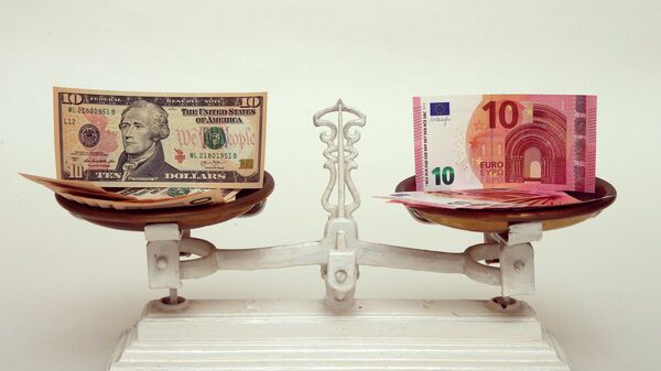 U.S. Dollar and Euro banknotes on a pair of scales in Vienna are seen in this March 11, 2015 file photo - Sputnik Mundo