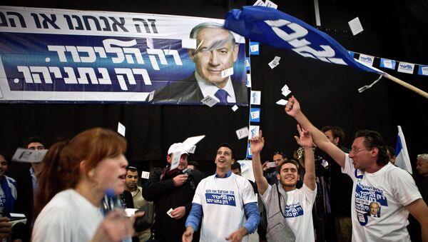 Likud party supporters react after hearing exit poll results in Tel Aviv March 17, 2015. - Sputnik Mundo