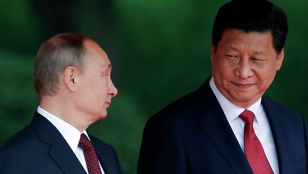El presidente de Rusia Vladímir Putin y su homologo chino, Xi Jinping - Sputnik Mundo