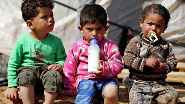 Syrian refugee children are seen in an informal tented settlement in Madaba city, near Amman March 13, 2015. - Sputnik Mundo