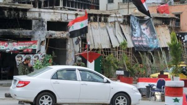 Блокпост сирийской армии на одной из улиц в центре Хомса - Sputnik Mundo