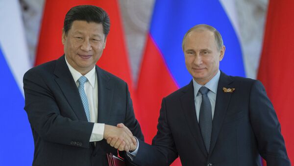 Presidente de China, Xi Jinping, y presidente de Rusia, Vladímir Putin - Sputnik Mundo