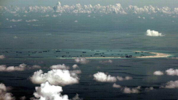 China's alleged on-going reclamation of Mischief Reef in the Spratly Islands. - Sputnik Mundo