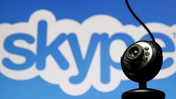 A web camera is seen in front of a Skype logo in this photo illustration taken in Zenica, May 26, 2015 - Sputnik Mundo