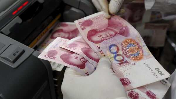 Banknotes at a branch of Bank of China in Changzhi, Shanxi province in this September 16, 2008 - Sputnik Mundo