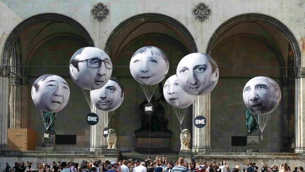 Globos con rostros de los líderes del G7 - Sputnik Mundo