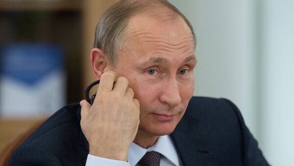 El presidente de Rusia, Vladimir Putin, durante una reunión con los líderes de las agencias de noticias más importantes del mundo - Sputnik Mundo