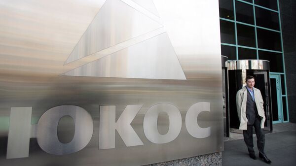 Logo de la petrolera Yukos, cuyos activos ahora pertenecen a la empresa Rosneft - Sputnik Mundo