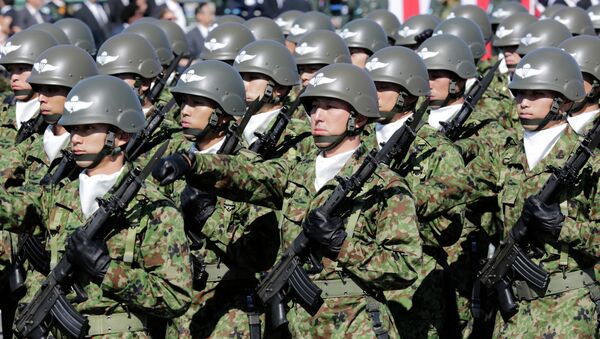 In this Oct. 27, 2013 file photo, members of Japan Self-Defense Forces march during the Self-Defense Forces Day at Asaka Base, north of Tokyo. - Sputnik Mundo