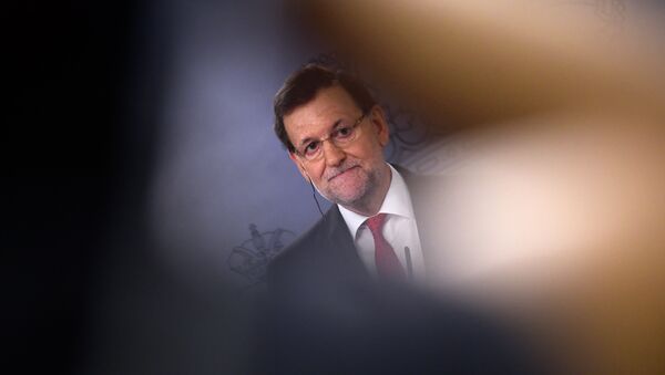 Spanish Prime Minister Mariano Rajoy listens during a joint press conference with Algerian Prime Minister at the Moncloa palace in Madrid on July 21, 2015. - Sputnik Mundo
