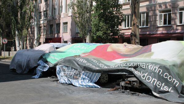 Coches quemados de la OSCE en Donetsk - Sputnik Mundo