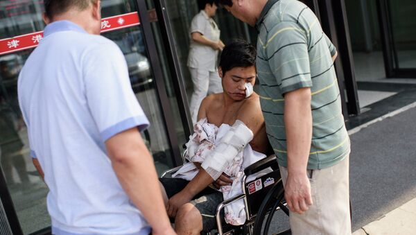 Víctima de explosiones en Tianjin, China - Sputnik Mundo