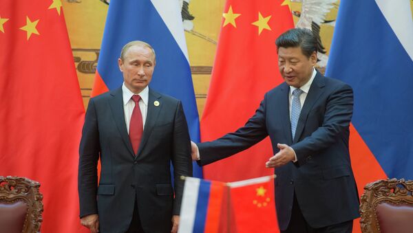 Президент России Владимир Путин (слева) и председатель Китайской Народной Республики Си Цзиньпин - Sputnik Mundo