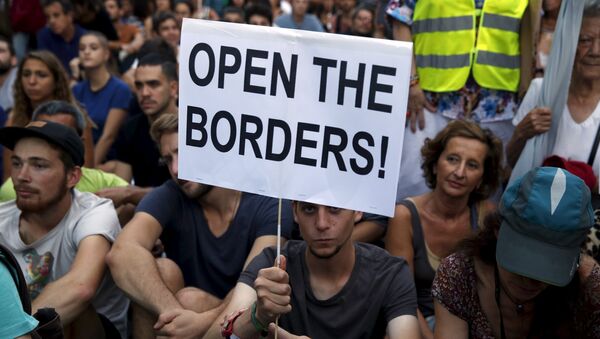 Manifestación en solidaridad con los refugiados en Madrid - Sputnik Mundo