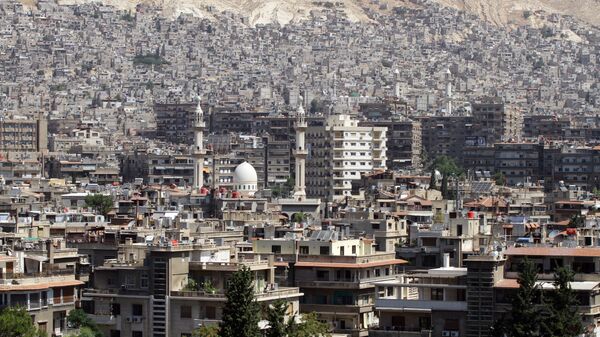 A general view shot taken on June 30, 2015, shows a neighbourhood in the Syrian capital Damascus. - Sputnik Mundo
