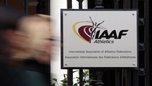 A woman walks past the IAAF (The International Association of Athletics Federations) headquarters in Monaco November 4, 2015 - Sputnik Mundo