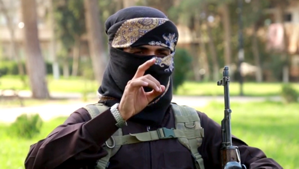Militante del grupo terrorista Estado Islámico - Sputnik Mundo
