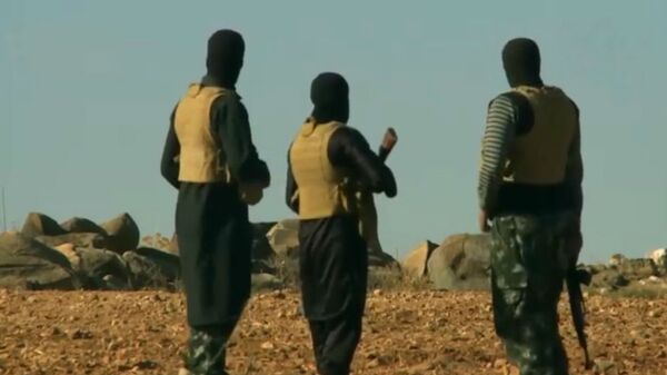Militantes del grupo terrorista Daesh - Sputnik Mundo