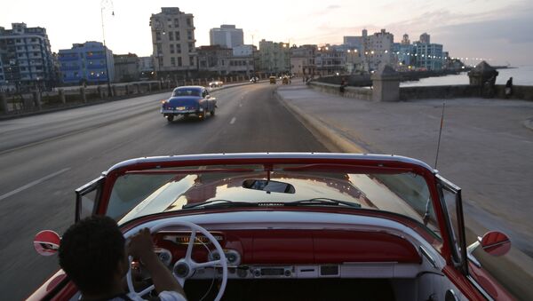 Michel Salgado drives his 1957 Mercury Monterey convertible along the Malecon in Havana, Cuba - Sputnik Mundo