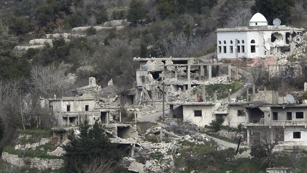 A general view shows damaged buildings in the town of Rabiya - Sputnik Mundo