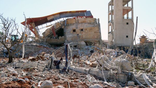 Restos de un edificio en Siria - Sputnik Mundo