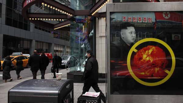 A poster ad that reads : DPRK: STOP NUCLEAR GAMBLE! is displayed on a street near Times Square in New York on February 9,2016 - Sputnik Mundo