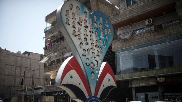 El primer día de la tregua en Siria, las fotos de las víctimas de la Guerra en una de las calles de Damasco - Sputnik Mundo