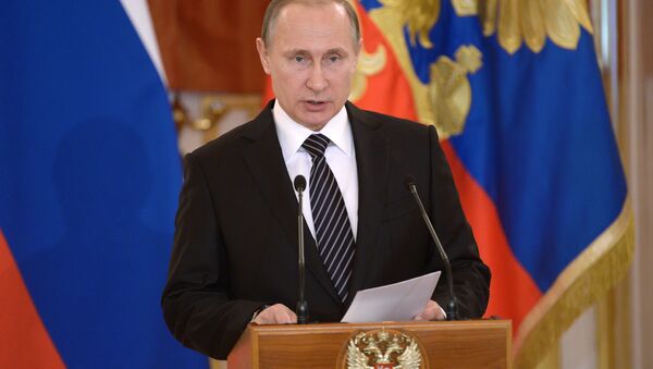 Vladímir Putin, el presidente de Rusia, en la ceremonia de condecoración a las fuerzas aéreas del país por su labor en Siria - Sputnik Mundo