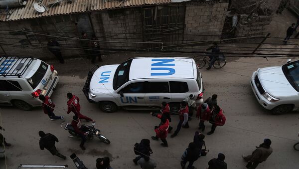 Vehículos de la ONU en un convoy con ayuda humanitaria en Siria - Sputnik Mundo