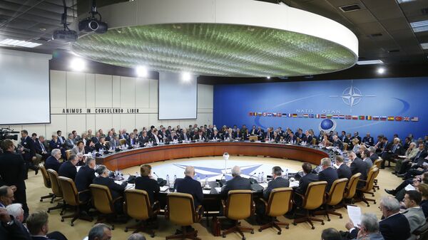 A general view of the table for a meeting of the NATO-Russia Council at the level of defense ministers at NATO headquarters in Brussels on Wednesday, Oct. 23, 2013 - Sputnik Mundo