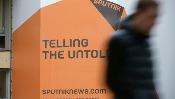 Логотип международного информационного бренда Спутник - Sputnik Mundo