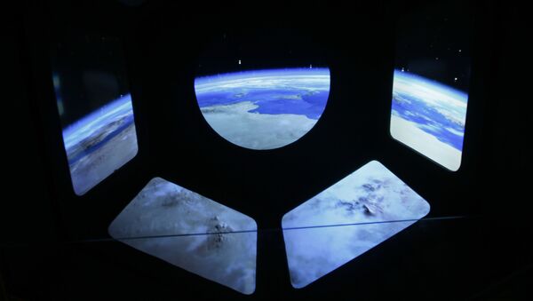 A reproduction of the view of the earth from a spaceship is displayed at the museum of the science and technologies in Milan, Italy, Friday, Feb. 12, 2016 - Sputnik Mundo